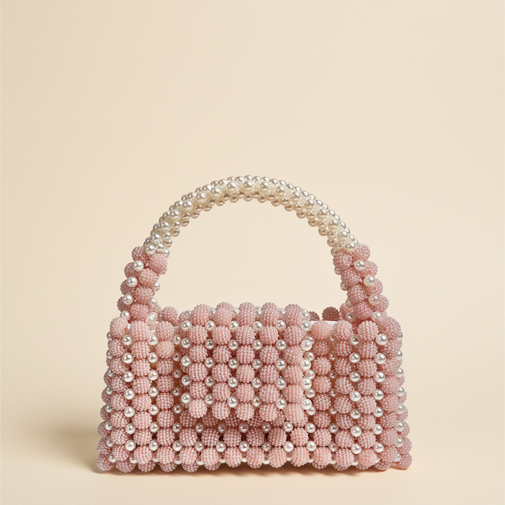 Pink pearl beaded handbag clean hero cream background