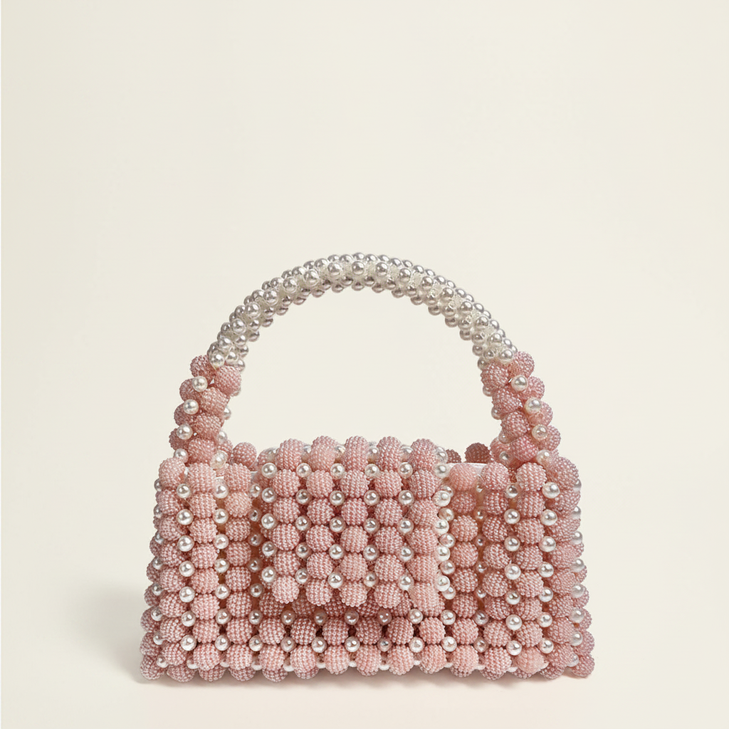 Pink pearl beaded handbag cinematic Vogue accessories campaign