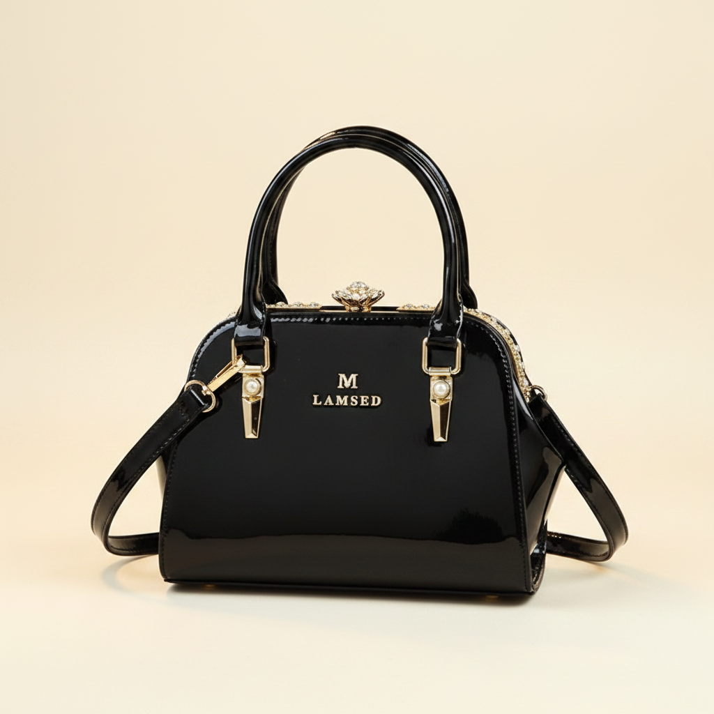 LAMSED glossy black patent leather shell handbag clean cream background no props